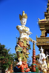 A vertical image of a statue of a deity located in a temple in Thailand, considered sacred in Thai Buddhism.