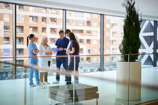 Healthcare team collaborates on patient care strategies in modern medical facility