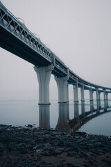 Surreal overpass over the water, reflection, minimalistic