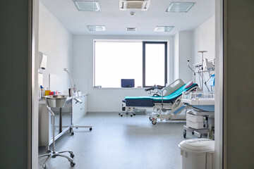 Modern hospital room with a patient bed and medical equipment for healthcare and recovery