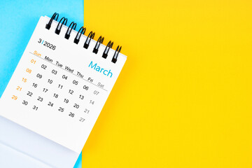 March 2026, Monthly desk calendar for 2026 year on yellow and blue background.