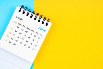June 2026, Monthly desk calendar for 2026 year on yellow and blue background.