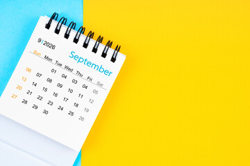 September 2026, Monthly desk calendar for 2026 year on yellow and blue background.