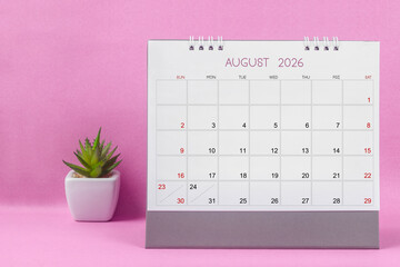 August 2026 desk calendar for year 2026 on pink background.