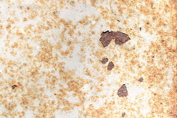 Detailed Close-Up of Rusty Metal Surface with Flaking Paint Texture