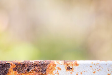 Close-Up View of Rusty Metal Surface with Blurred Background