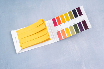 Universal indicator paper with acidic testing.