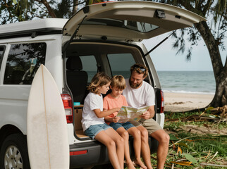 Family Beach Van Adventure: Parents And Kids Reading Map By Ocean During Summer Road Trip
