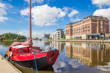 Little wooden sailng ship in the inner harbor of Emden, Germany