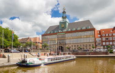 Cruiseship in front of the historic town hall in Emden, Germany
