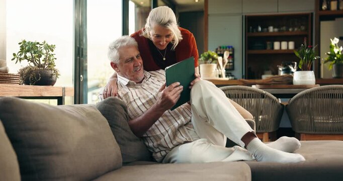 Tablet, conversation and senior couple on sofa with planning for retirement vacation together in home. Talking, technology and elderly people in living room with booking tickets for holiday in house.