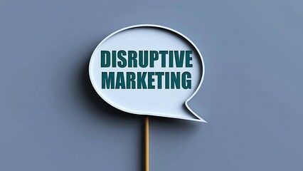 White speech bubble sign with "DISRUPTIVE MARKETING" in teal text on a muted blue background, advertising concept