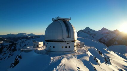 Observatory dome time-lapse in snowy mountains during sunrise to sunset, astronomical research and scientific equipment footage