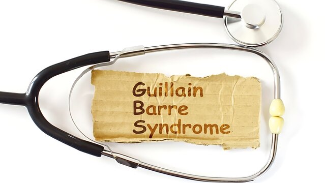Guillain Barre Syndrome text on distressed cardboard with stethoscope on white background, medical concept, top view