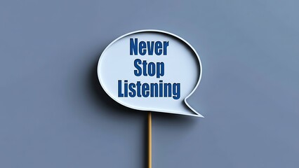 White speech bubble sign with blue text saying 'Never Stop Listening' on a simple gray background with a light wooden stick, conveying a message of active listening and communication