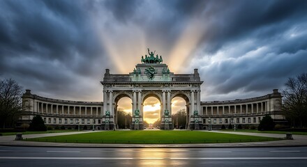 Obraz premium Majestic archway illuminated by dramatic sunbeams piercing stormy clouds.