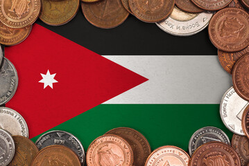 Coins on flag of Jordan trading investment business currency concept
