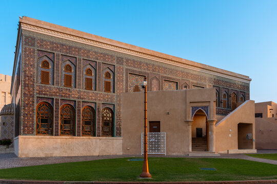 Doha, Qatar - 05 November 2025: View of the traditional architecture with intricate patterns and arched windows standing proudly against the clear blue sky, showcasing the rich cultural heritage.