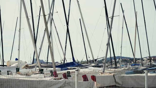 Sailing boats are moored for the winter and are located on the beach in a special area. High quality 4k footage