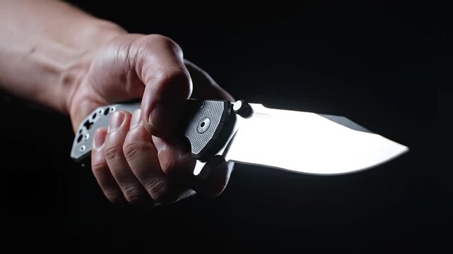 Hand holding a folding knife