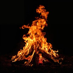 Obraz premium Large open bonfire burning at night with a person nearby highlighting human interaction with fire and outdoor activity