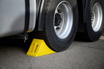 Special wheel chocks for trucks, yellow.