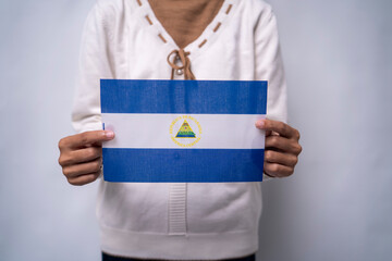 Hands Holding Flag of the Nation Nicaragua