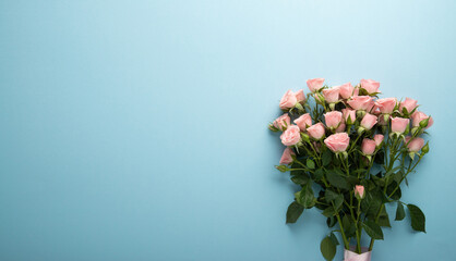 Pink rose flower bouquet on blue background. Floral wallpaper, banner. February 14, valentine's day, love, 8 march women's day theme. Birthday, wedding gift.