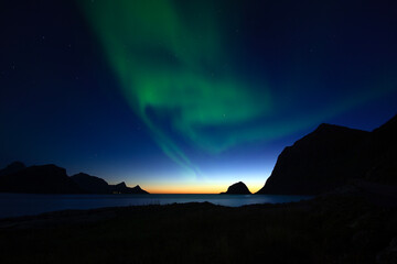 Northern lights on sky in Lofoten archipelago