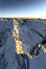 Aerial View Sunlit Peaks Piercing