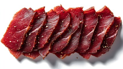 Fototapeta premium A close up of a piece of meat with pepper and salt sprinkled on it