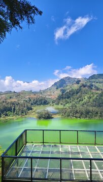 View of Telaga Warna sulfur lake from a glass observation deck in Dieng Plateau, Central Java, Indonesia
