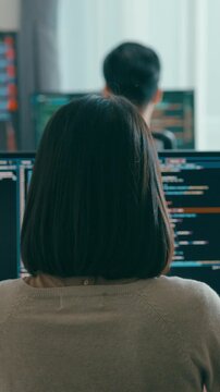 Vertical Screen : Closeup Adult Asia male, female freelance typing write prompt AI bot IT app smart program nomad, video game, terminal with coding language designer, big data center desktop computer.