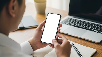Person holding smartphone with blank screen at desk with laptop and notebook social media thumbnail poster banner download 2026 2027 1