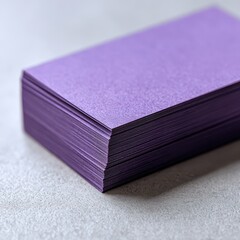 Minimalist purple business cards on a clean desk for professional branding