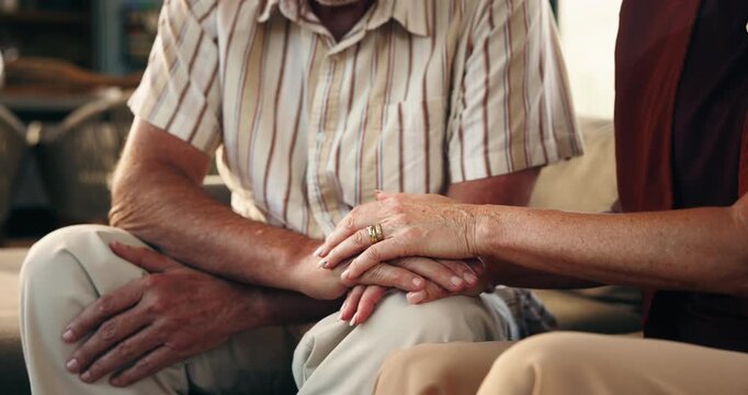 Love, holding hands and old couple in home, support and bonding together in lounge. Apartment, man or woman on couch, romance or trust in marriage, empathy or compassion for grief, loss or retirement
