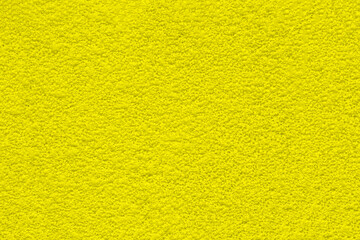Bright yellow abstract texture background. Rough golden surface shows natural cracks, uneven pattern. Digital art creates organic, earthy feel. Good for modern graphic web banner design.