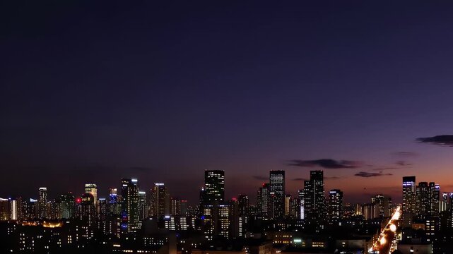 City skyline at dusk with lights. In this video, we showcase a stunning city skyline at dusk, highlighting the transition from day to night and the remarkable beauty of the illuminated buildings.