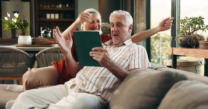 Tablet, hug and senior couple on sofa with celebration for pension fund payout together. Happy, digital technology and elderly people in living room with embrace for investment approval in home.