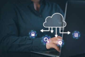 Person working on a laptop with cloud computing and data security icons. Representing secure cloud storage, database management, and global network connectivity in a digital workspace