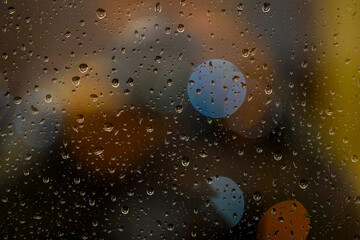 colorfull bokeh and rain drops on window © Birol Dincer 