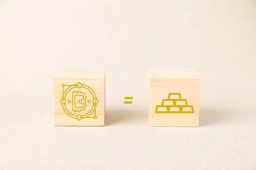 Bitcoin and gold bars icons on wooden blocks with an equal sign, representing the concept of digital gold, cryptocurrency value, financial investment stability, and wealth diversification in 2026.