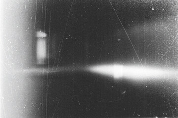 retro film overlay effect with scratch dust and light leaks.retro Cinematic grain noisy distressed texture light ray flare lens on black background.black and white abstract light background © ZMC-Studio