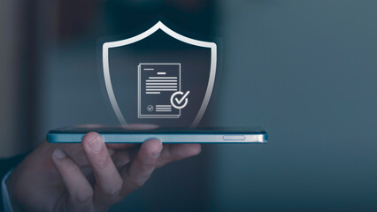 Cybersecurity and data protection. Concept of personal information security, privacy policy, firewall, and secure login for corporate network. Professional holding shield icon with padlock on mobile