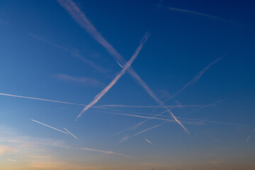 contrail of aircrafts in sunset mood