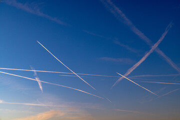 contrail of aircrafts in sunset mood