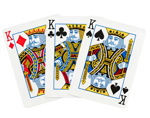 Three powerful king playing cards fanned out against a dark background isolated on transparent background