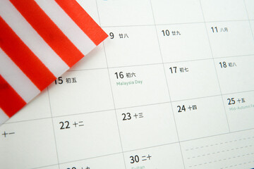 Close up calendar showing Malaysia Day with Malaysian flag. Concept of national pride, patriotism,...