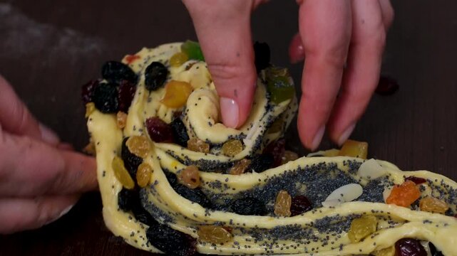 baking for Christmas Easter Making homemade cruffin step by step, rolling yeast dough, spreading butter and poppy seeds, adding dried fruits, baking layered cruffins, cooking process in the kitchen