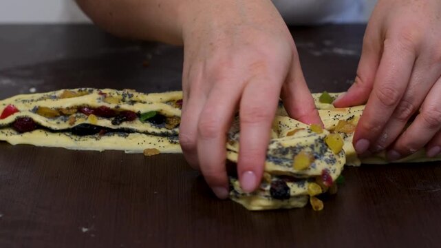 baking for Christmas Easter Making homemade cruffin step by step, rolling yeast dough, spreading butter and poppy seeds, adding dried fruits, baking layered cruffins, cooking process in the kitchen